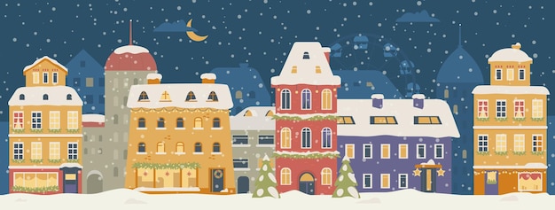 Rua da cidade na noite de Natal com casas bonitas