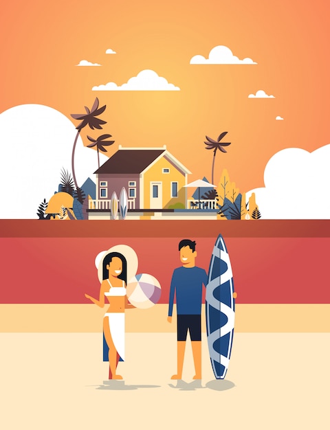 surfista casal verão férias homem mulher prancha de surf na praia do sol casa villa tropical ilha vertical