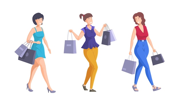 Três mulheres bonitas felizes andando com sacolas de compras