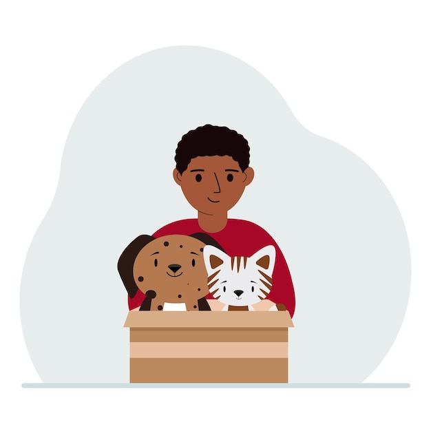 Vetor um garotinho segura uma caixa de papelão com um gato e um cachorro o conceito de ajuda de resgate e cuidados com animais de estimação