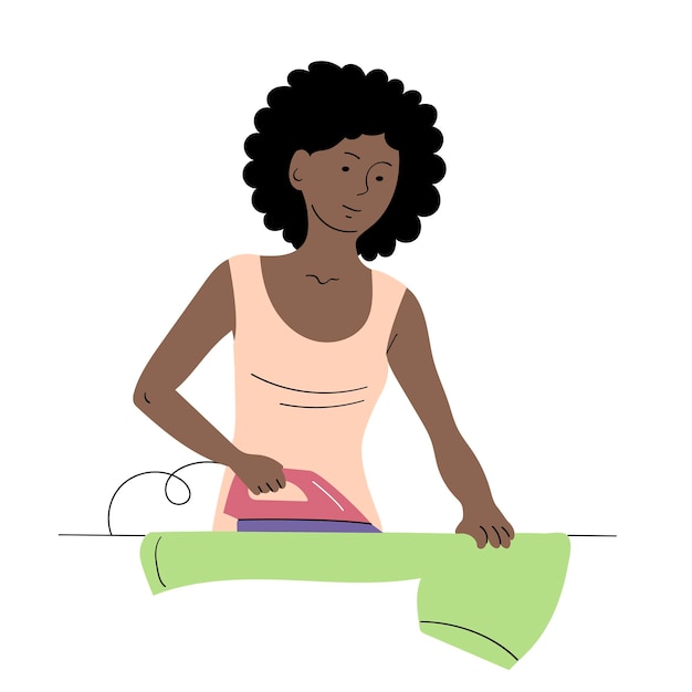 Uma jovem mulher ferre roupas em casa.
