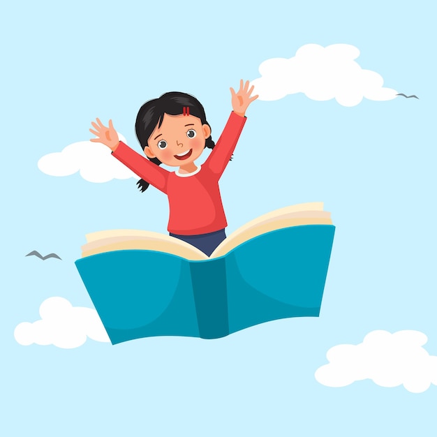 Uma menina bonita a voar num grande livro aberto a agitar as mãos no céu azul.