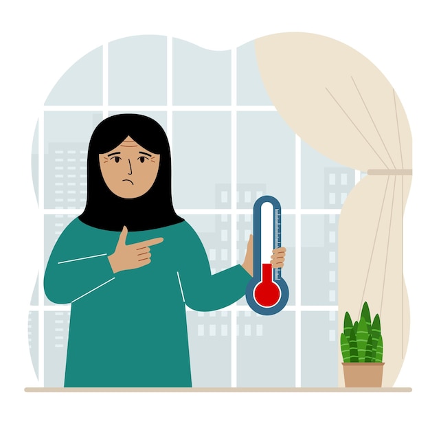 Uma mulher perto da janela com um dispositivo para medir a temperatura na sala