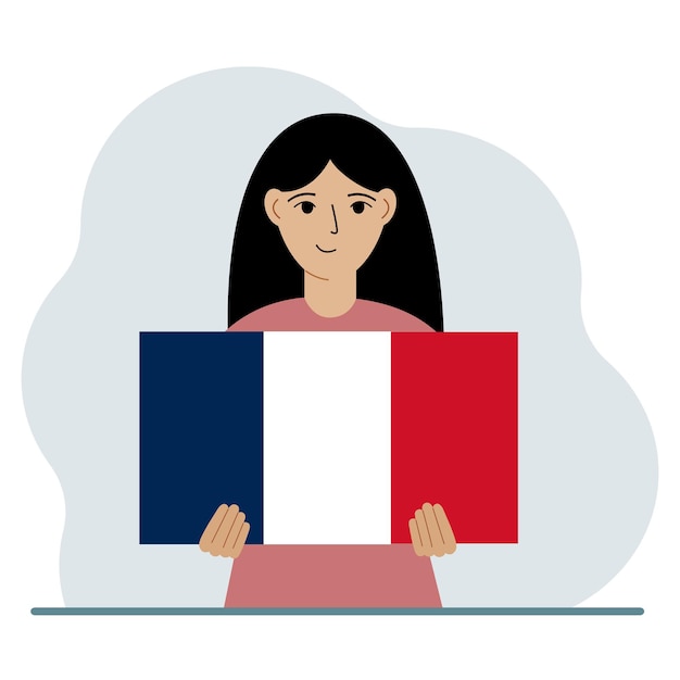 Uma mulher segura uma bandeira francesa em suas mãos o conceito de feriado nacional de demonstração ou patriotismo nacionalidade