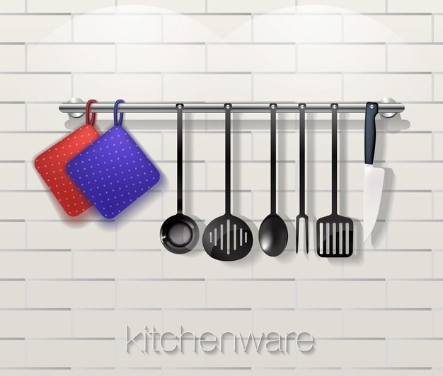 Utensílios de cozinha com utensílios de cozinha em um fundo de tijolo.