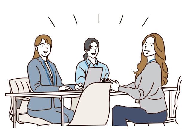Várias mulheres de negócios a ter uma reunião no escritório.