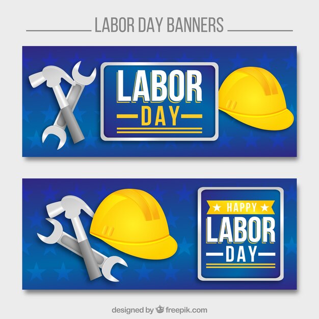 Bandiere di giorno di lavoro con il casco e gli strumenti