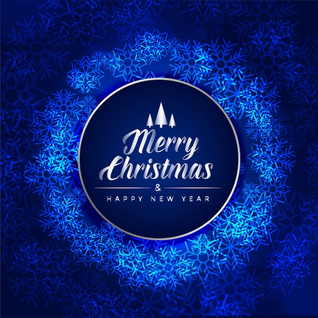 Carta blu di festival di buon Natale fatta con i fiocchi di neve