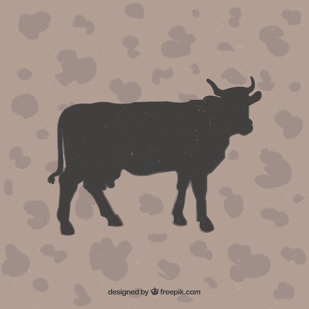 Cow silhouette su sfondo animal print