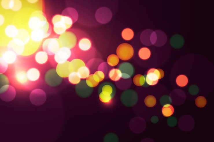 Vettore gratuito effetto delle luci bokeh sullo sfondo scuro
