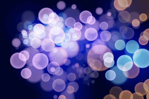 Effetto delle luci di Bokeh sul concetto scuro della carta da parati