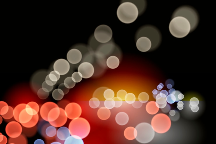 Vettore gratuito effetto luci bokeh su sfondo scuro