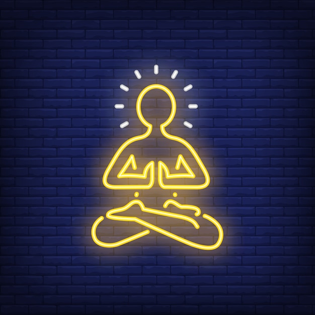 Insegna al neon della siluetta della persona di meditazione