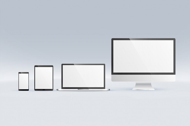 Vettore gratuito mockup di monitor computer portatile tablet e smartphone
