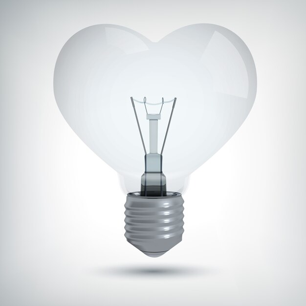 Realistico concetto di design della lampadina a forma di cuore su grigio isolato