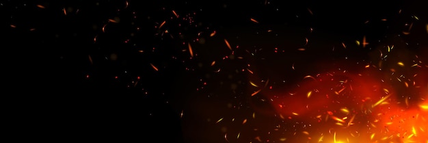 Scintille di fuoco e fiamme su sfondo nero
