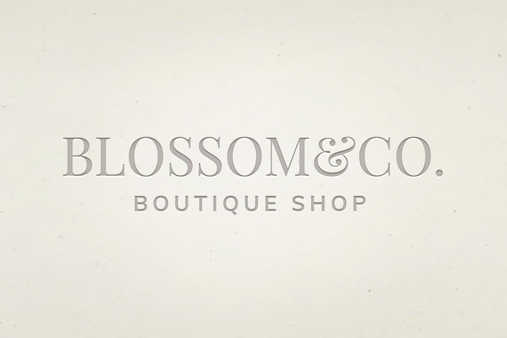 Vettore gratuito vettore modificabile del logo aziendale boutique con testo in fiore e co