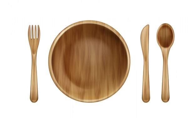 Vista superiore di legno del piatto, della forchetta, del cucchiaio e del coltello.