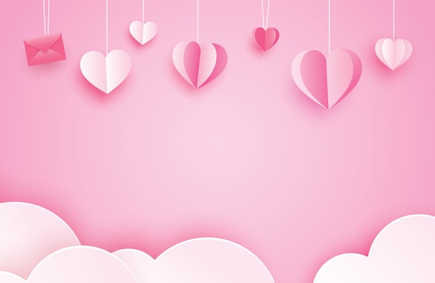 Auguri di felice giorno di San Valentino con cuori di carta appesi su sfondo rosa pastello.