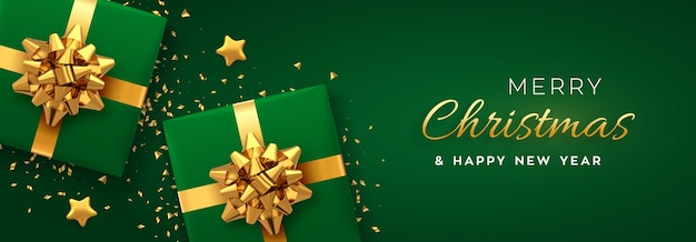 Banner di Natale. Scatole regalo verdi realistiche con fiocco dorato, stelle dorate e coriandoli glitterati. Sfondo di Natale, sito Web di intestazioni.