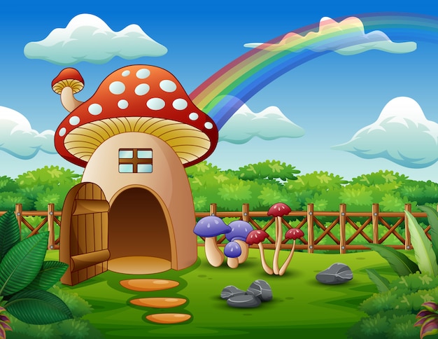 Casa dei funghi con un arcobaleno nel campo