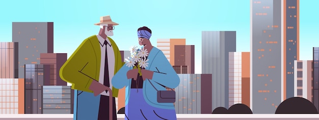 Coppia senior con fiori che hanno un appuntamento con i nonni afroamericani che trascorrono del tempo insieme sullo sfondo del paesaggio urbano