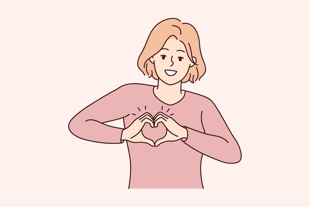 Donna sorridente mostra il gesto della mano del cuore