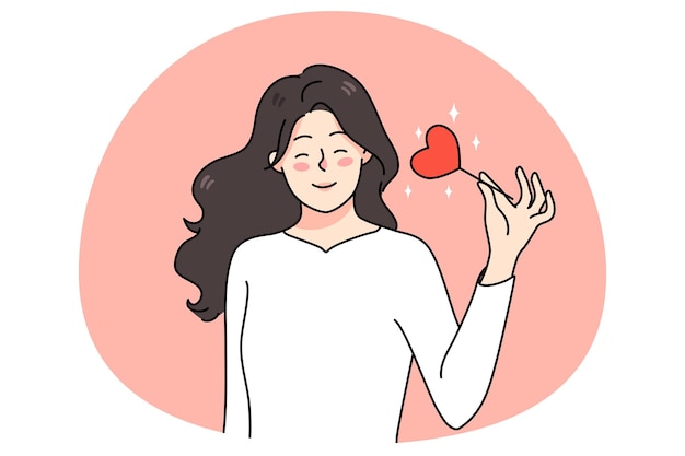 Donna sorridente tenere il cuore sul bastone