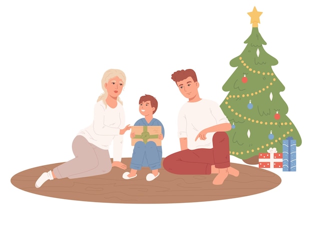 Famiglia che fa regali vicino all'albero di Natale