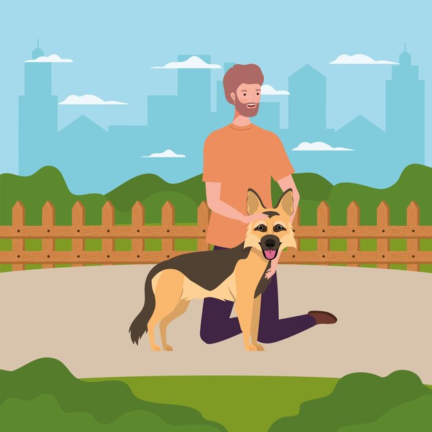 Giovane con simpatico cane mascotte nel campo