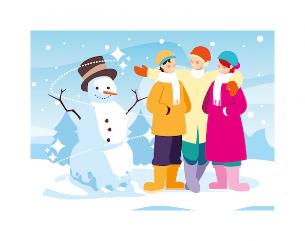 Gruppo di persone con pupazzo di neve nel paesaggio invernale