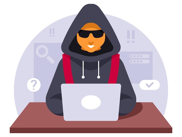 Hacker con cappuccio e maschera nera che copia informazioni dal portatile Crimine su Internet Sicurezza informatica c