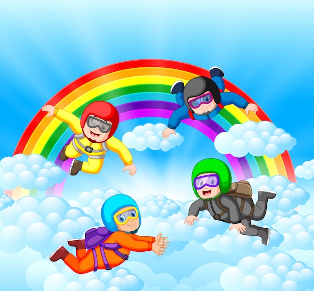 I paracadutisti si divertono nella stupefacente nuvola con paesaggi arcobaleno
