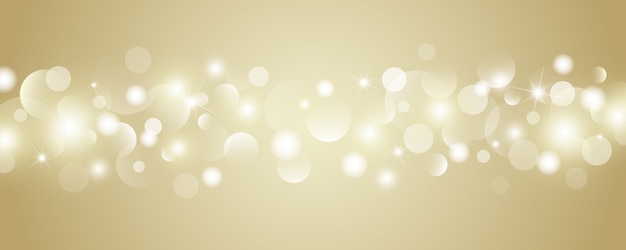 Il bokeh astratto dell'oro accende il fondo