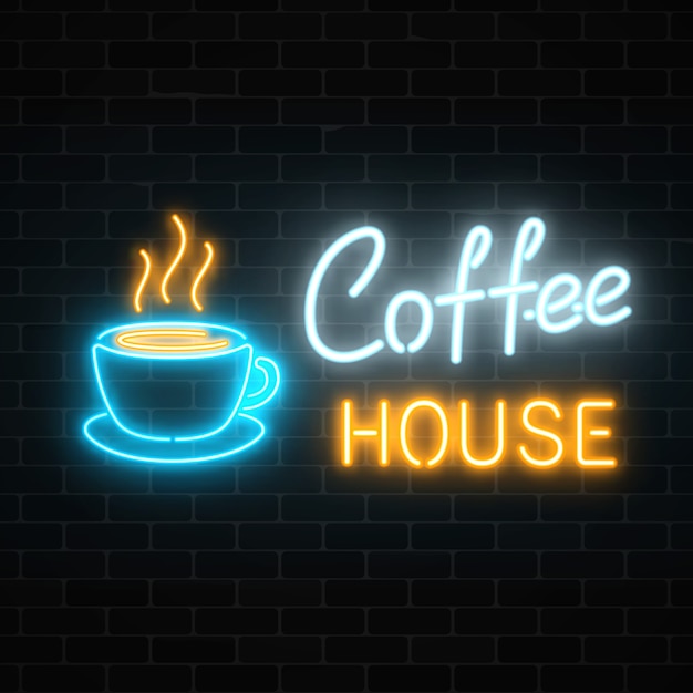 Insegna al neon del caffè su un muro di mattoni scuro. Segno di caffè bevanda e cibo caldo.
