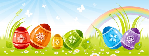 Insegna felice di Pasqua con le uova di colore sull'erba.