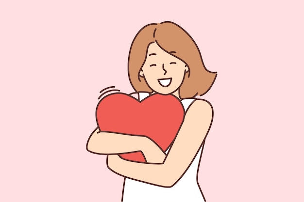 La donna felice tiene il cuore nelle mani