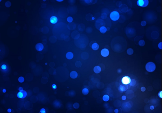 Luce offuscata del bokeh su fondo blu scuro. Scintillio astratto sfocato stelle lampeggianti e scintille.