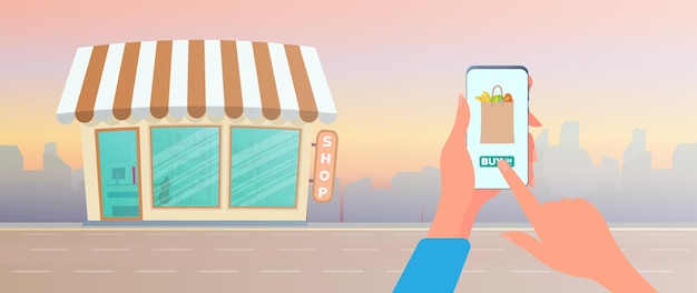 Ordina da mangiare a casa. La mano tiene lo smartphone.
