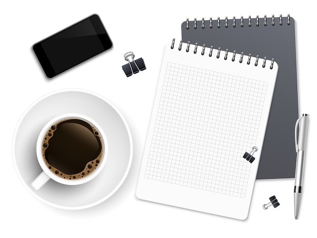 Pausa caffè d'affari vista dall'alto con blocco note, telefono e tazza di caffè