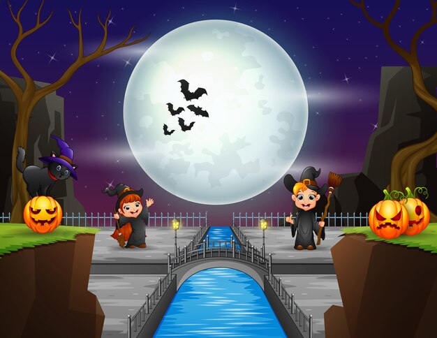 Piccola strega che gioca nella notte di Halloween