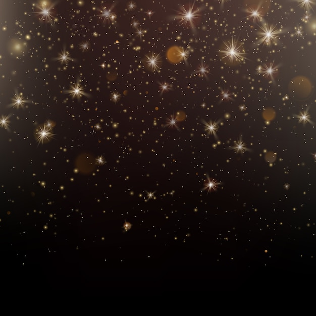 Polvere di stelle scintillanti d'oro particelle scintillanti su sfondo scuro.