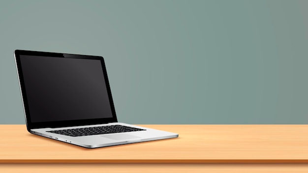 Schermo in bianco del computer portatile sulla tavola di legno