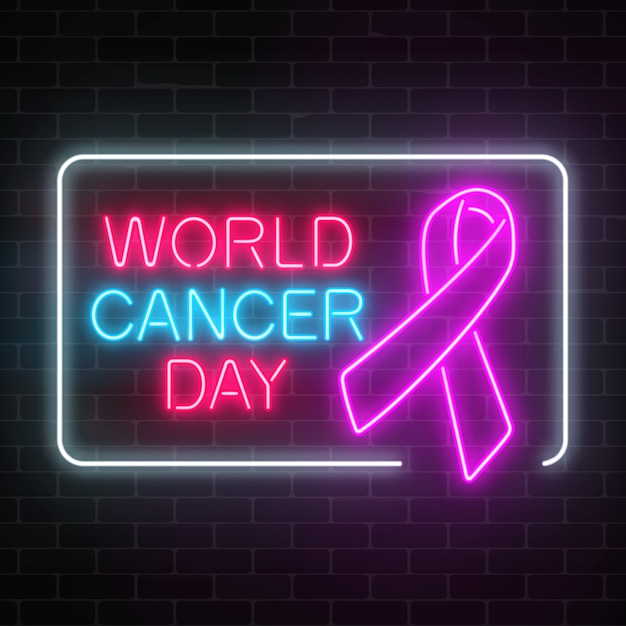 Segno d'ardore di giornata mondiale del cancro al neon su un fondo scuro del muro di mattoni. Nastro rosa come mese per la consapevolezza del cancro.