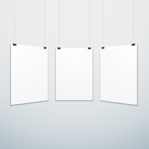 Set di poster vuoto bianco verticale vettoriale sospeso su morsetti per ufficio mock up modello vuoto ombra realistica isolato sfondo grigio bianco