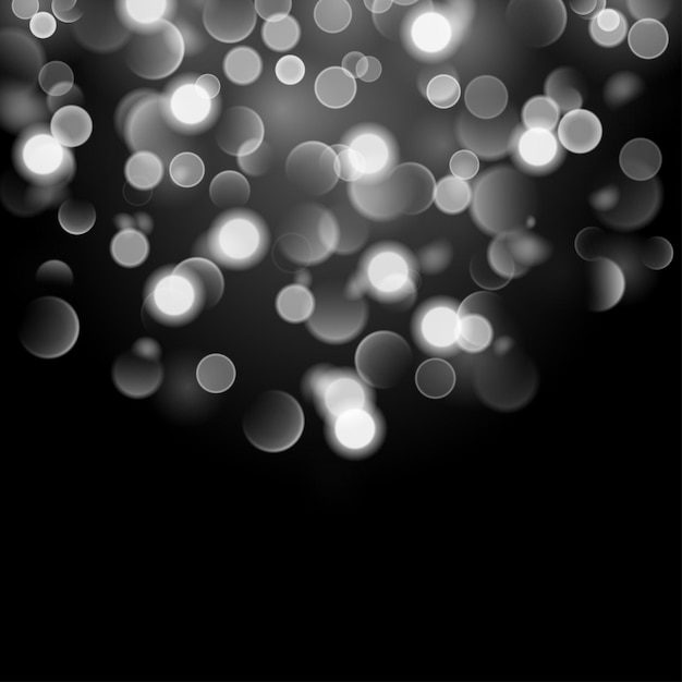 Sfondo astratto con effetto bokeh Luci sfocate sfocate nei colori bianchi Luci bokeh bianche su sfondo nero