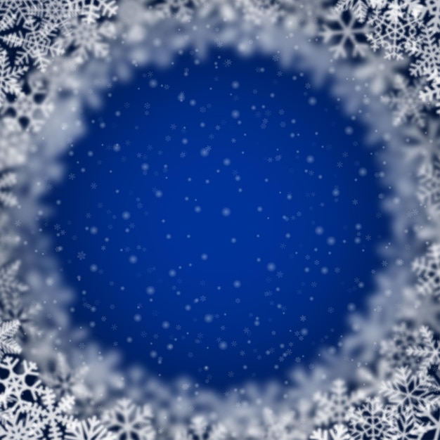 Sfondo di Natale di fiocchi di neve di forma diversa sfocatura e trasparenza disposti in cerchio su sfondo blu