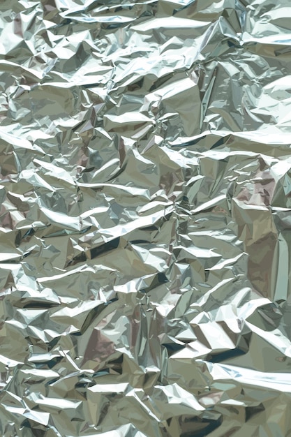 Trama di lamina metallica. Sfondo metallico. Metallo scintillante, schiacciato, superficie glitterata, fondale. Trama stropicciata. Superficie riflettente. Fondo piegato, sgualcito o sgualcito. Illustrazione vettoriale