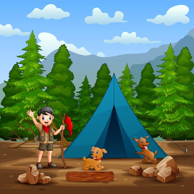 Un ragazzo scout e cani davanti alla tenda