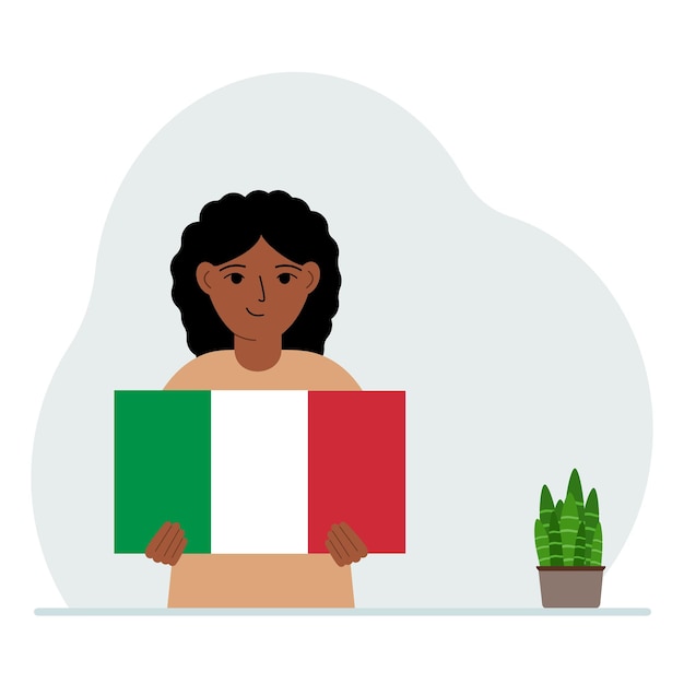 Una bambina tiene in mano la bandiera d'Italia Il concetto di festa nazionale dimostrativa o patriottismo Nazionalità